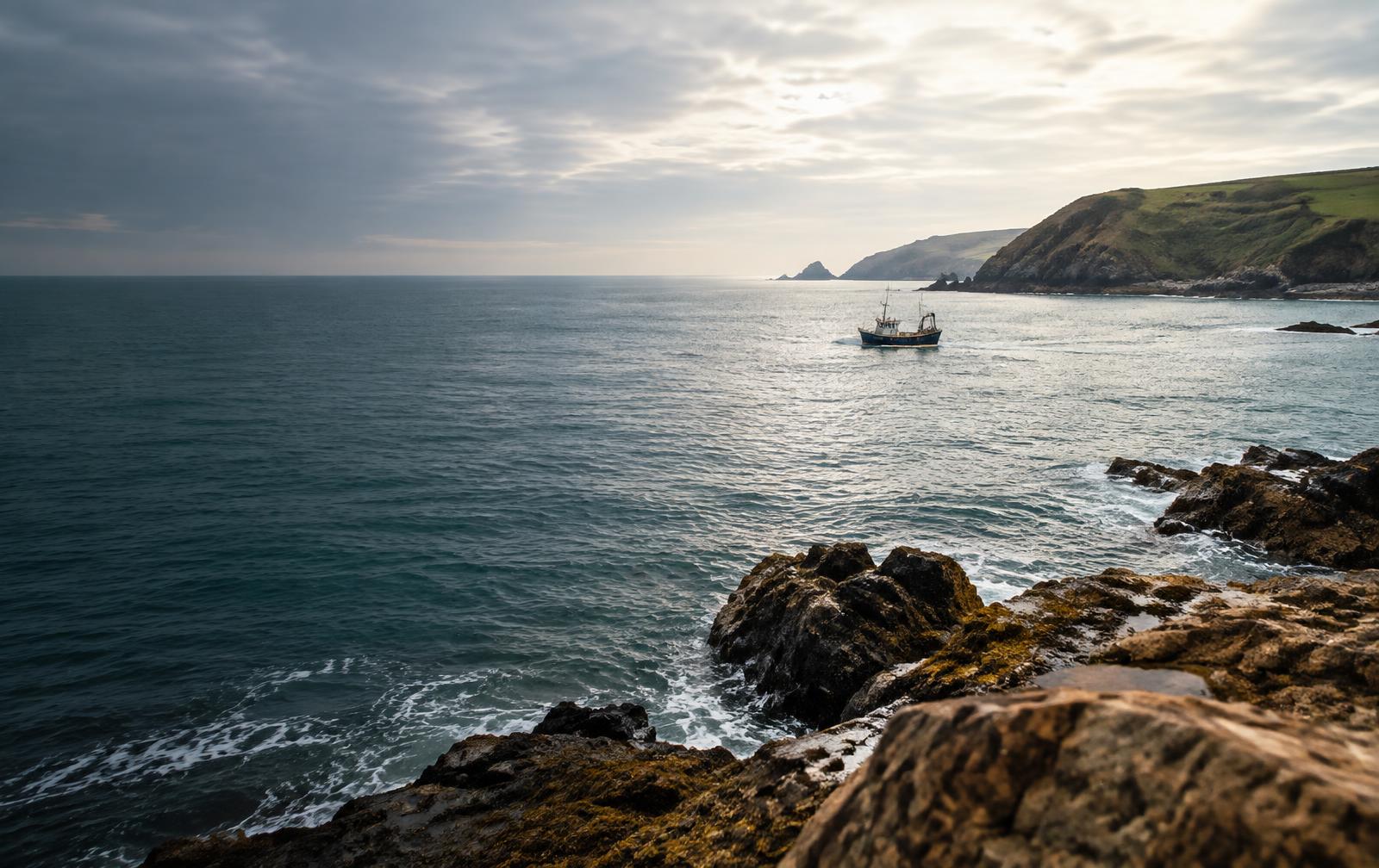 Fishing boat off a rocky South West coast